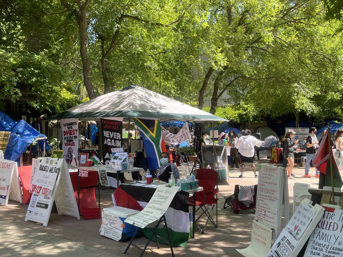 An encampment at Sacramento State University takes place in the Library Quad with peaceful protesters displaying multiple signs demanding California State Universities divest from funding Israel. Sac State’s encampment began on April 29 and will remain in place if it continues to be peaceful until May 8, according to the State Hornet.