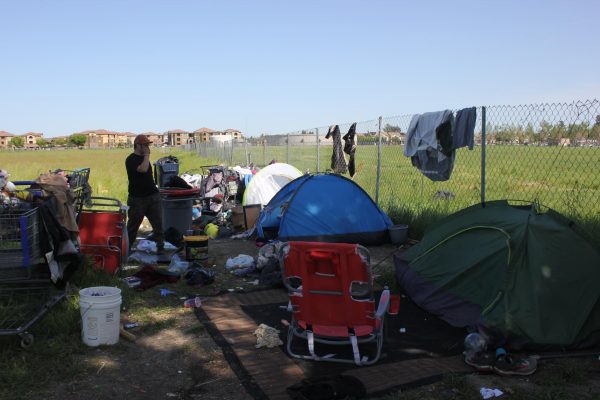 Tents of the unhoused across the street from Cosumnes River College campus on Bruceville Road. The streets may be seen as a better option to unhoused individuals because of poorly run shelters, according to the National Coalition for Homeless. 
