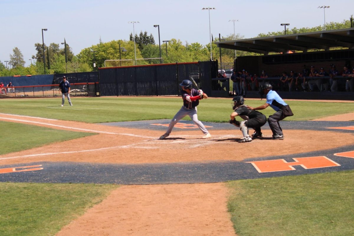 Noah Canter, sophomore catcher, prepares to swing against American River College on April 22. Canter finished the regular season with 15 home runs, breaking the record for most home runs in a regular season by a CRC athlete.