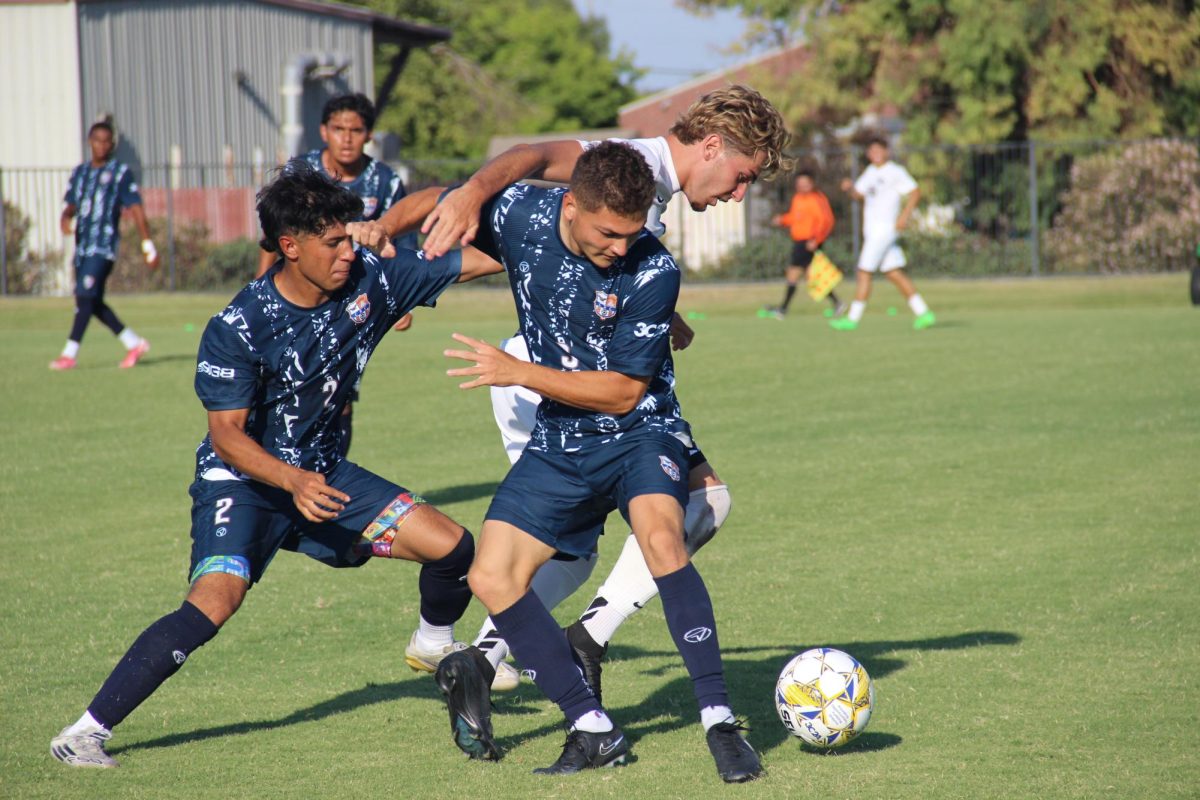 Freshman defender Jaden Campos and sophomore defender Camden Locke dueling for the ball against Butte College on Tuesday. The Hawks did not concede a goal in their first two games.     