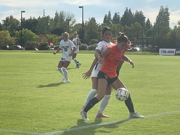Sophomore midfielder Isabel Amador shielding the ball from the opposing player in Tuesday’s game. The Hawks proceed to draw 0-0 at home against Hartnell College on Friday. 

