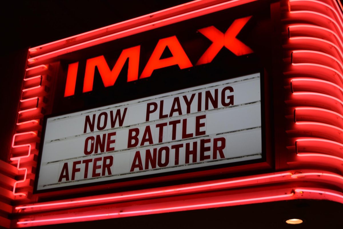 Esquire IMAX theatre’s marquee announcing they were playing “One Battle After Another.” The film made its theatrical debut on Sept. 26 and made around $22 million in its opening weekend, according to the Associated Press.    