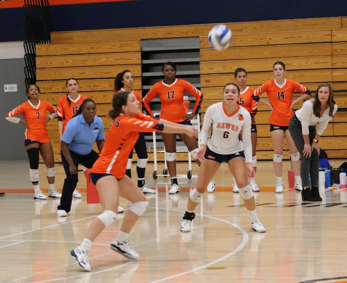 Sophomore defensive specialist Clara Belnap receiving a serve in the game against Modesto Junior College on Wednesday. The Hawks went on to lose their next game 3-0 away at Sac City. 
