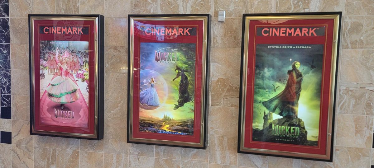 Three promotional posters for “Wicked: For Good” at Cinemark Century Laguna 16 and XD. Ariana Grande and Cynthia Erivo return to conclude their story as Glinda and Elphaba, but the film leaves more questions than answers. 

