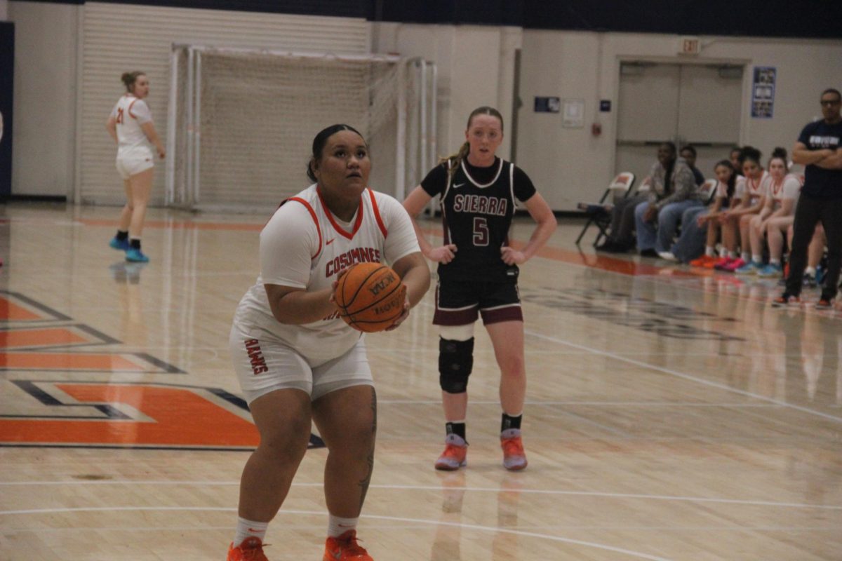 Freshman center Fifita Grewe lines up a free throw in the second quarter of the game against the Sierra College Wolverines on Friday. Though the Hawks lost the game 70-45, they’ve qualified for playoffs, which start on Wednesday.