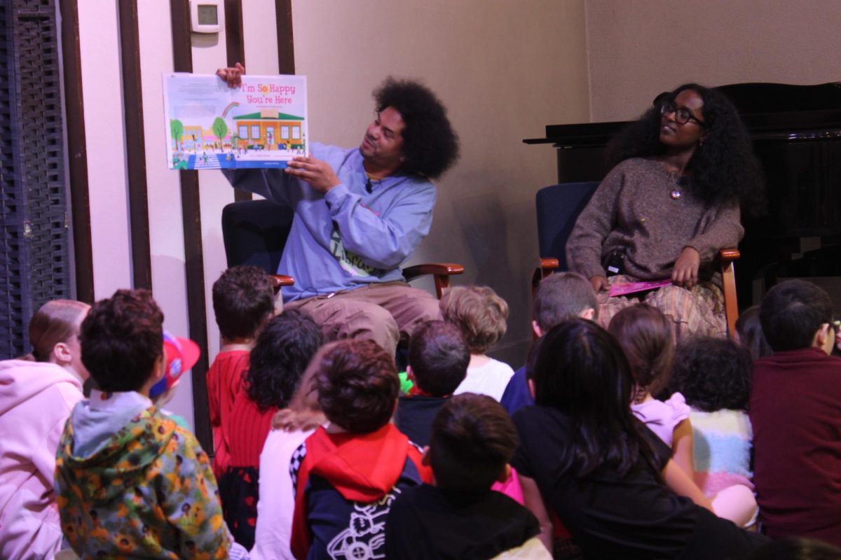Author and “Reading Rainbow” host Mychal Threets brings kids to the stage and reads his new book “I’m So Happy You’re Here” alongside local author Lydia Millyon at The Elk Grove United Methodist Church during his book tour on Saturday. Threets later donated $500 to each non-profit organization in attendance at the event.