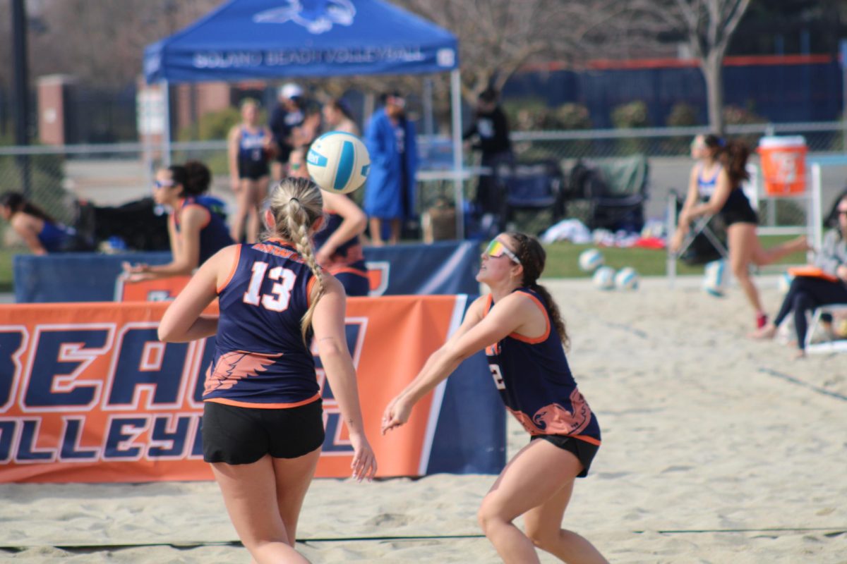 Freshman Clara Belnap (#2) prepares to set a ball during the team’s season opener against (College of the Siskiyous) on (Friday). The Hawks won both matches on the day, beating College of the Siskiyous 3-2 and Shasta 5-0.