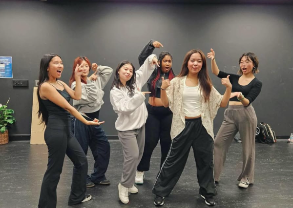 Members of Cosumnes River Dance Club point at Aliyah Cortez after she led a dance workshop in the Black Box Theater on Oct. 2. The CRDC meets once a week to learn a new dance and bond over their shared interests.
