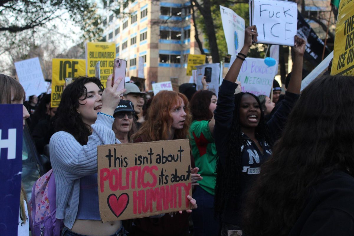 High school students chant in front of the John Moss Federal Building.