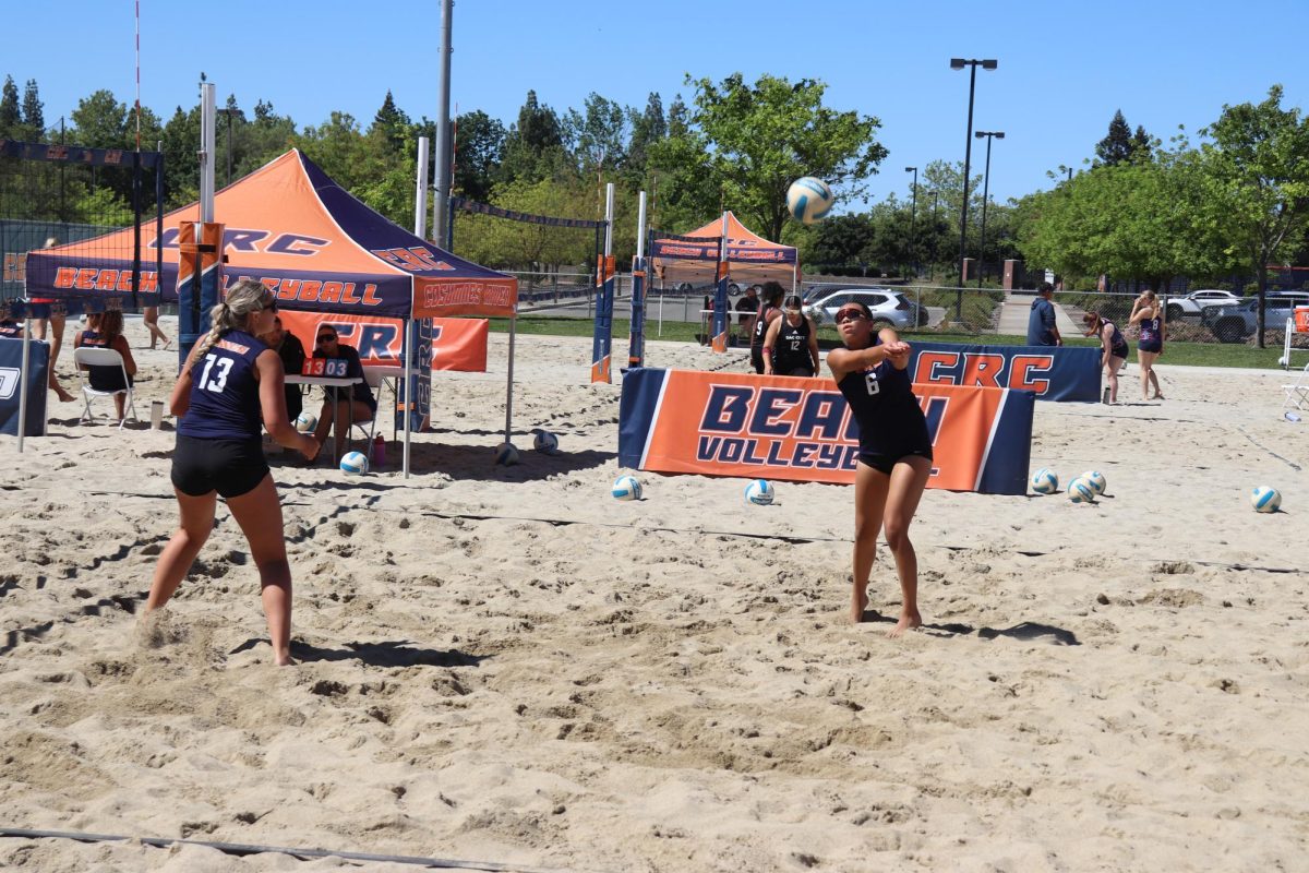 Freshman Emmerson Patterson (right) sets the ball during a game against Sacramento City College on Friday. The Hawks won both matches, beating Santa Rosa 4-1 and shutting out Sac City 5-0. 