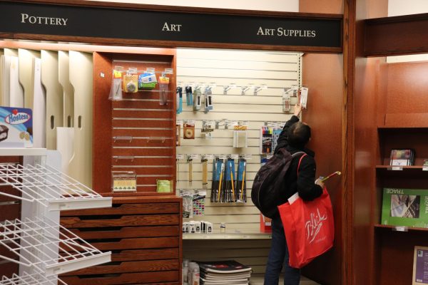 A student picking up art supplies at the Cosumnes River College bookstore on Wednesday. The bookstore is set to close July 1, with class materials available for at-home delivery and on-campus pickup, among other options, said Vice President of Administrative Services Theresa Tena.