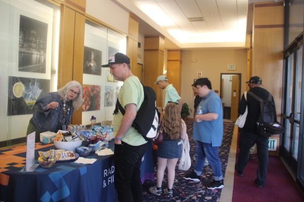 Students and guests gather in the lobby of the Cosumnes River College Recital Hall for the spring Radio, Television and Film Showcase on Friday. The showcase featured student-made films, audio productions and live studio projects from RTVF courses.